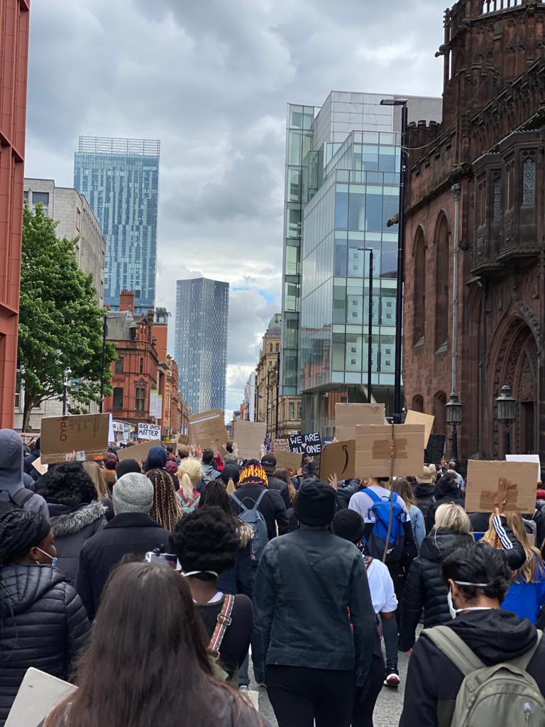 STOPM_2020_455_456b: photograph showing a large number of people in a protest march, in Manchester. The people in front are holding home made signs, which are plain on the back. The march was in Manchester on Saturday 6th June 2020. 