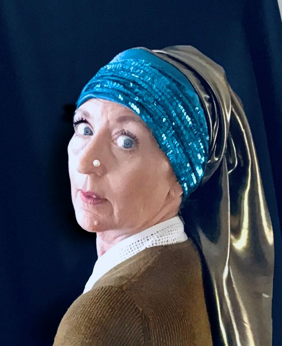 STOPM_2020_545a: self-timer photograph of Valerie, looking over the shoulder with a pearl on her nose and scarves of blue sequins and grey silk draped around her head [in the style of the painting The Girl with a Pearl Earring by Johannes Vermeer].