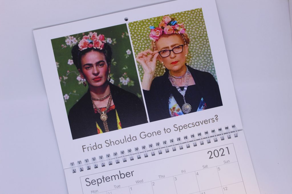 STOPM_2020_545c: close-up view of the September month of Valerie's Gallery calendar - the image on the left is a portrait of Frida Kahlo, on the right is Valerie's version, with flowers and jewellery to imitate Frida's adornments. Text says 'Frida Shoulda Gone to Specsavers?